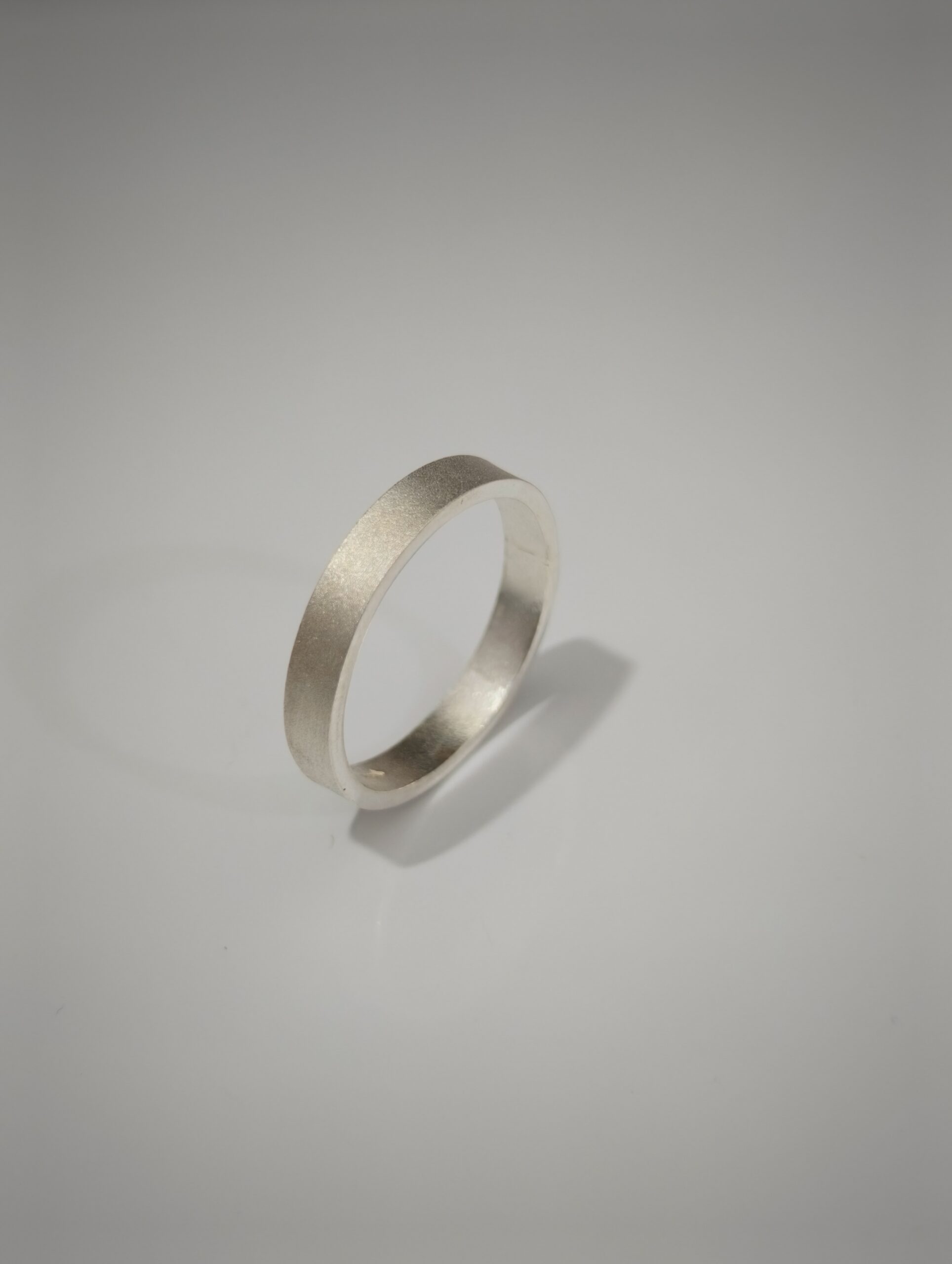 Satin Weight 999 fine silver ring with a satin-matte outer surface on a neutral background