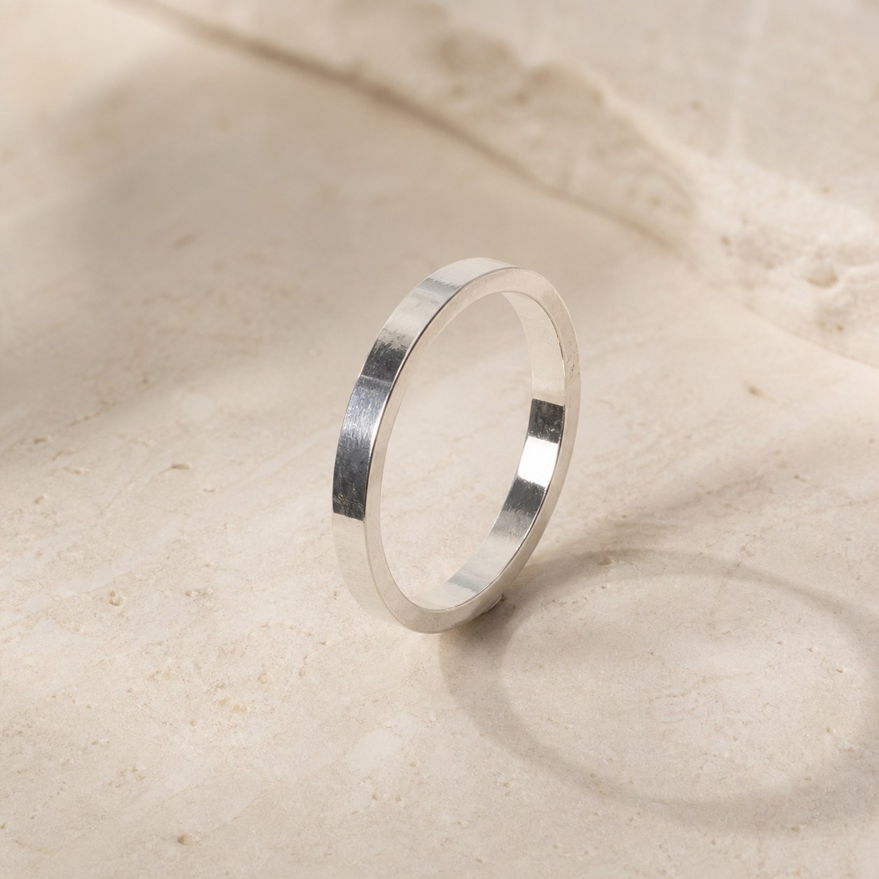Mirror Trace reflective 999 fine silver band on a neutral background