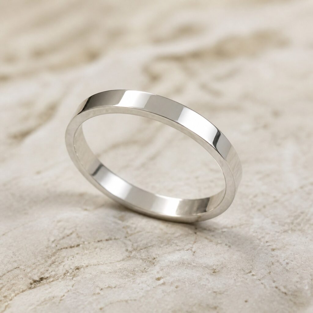 Close-up of hand-finished marks on the Mirror Trace fine silver band