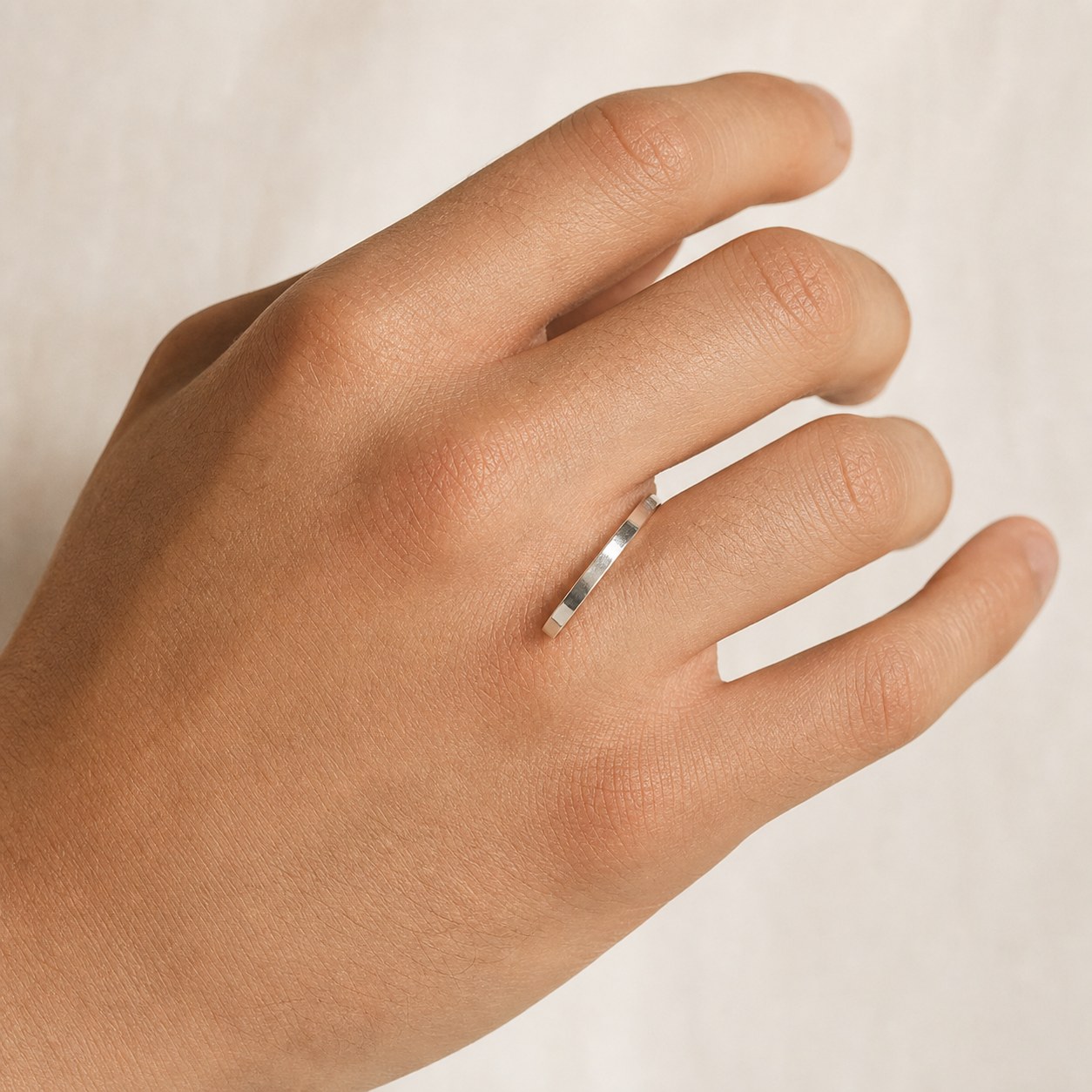 Mirror Trace fine silver band worn on a finger