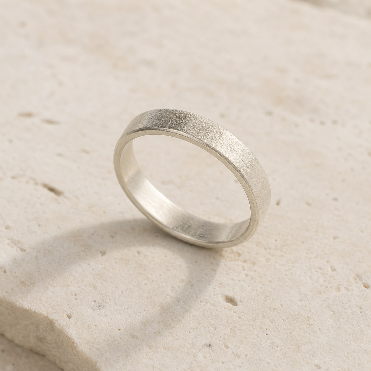 Close-up of the granular finish on the Quiet Texture fine silver band