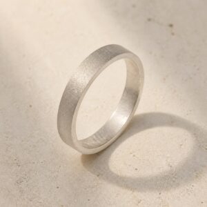 Satin Weight matte 999 fine silver band on a neutral background